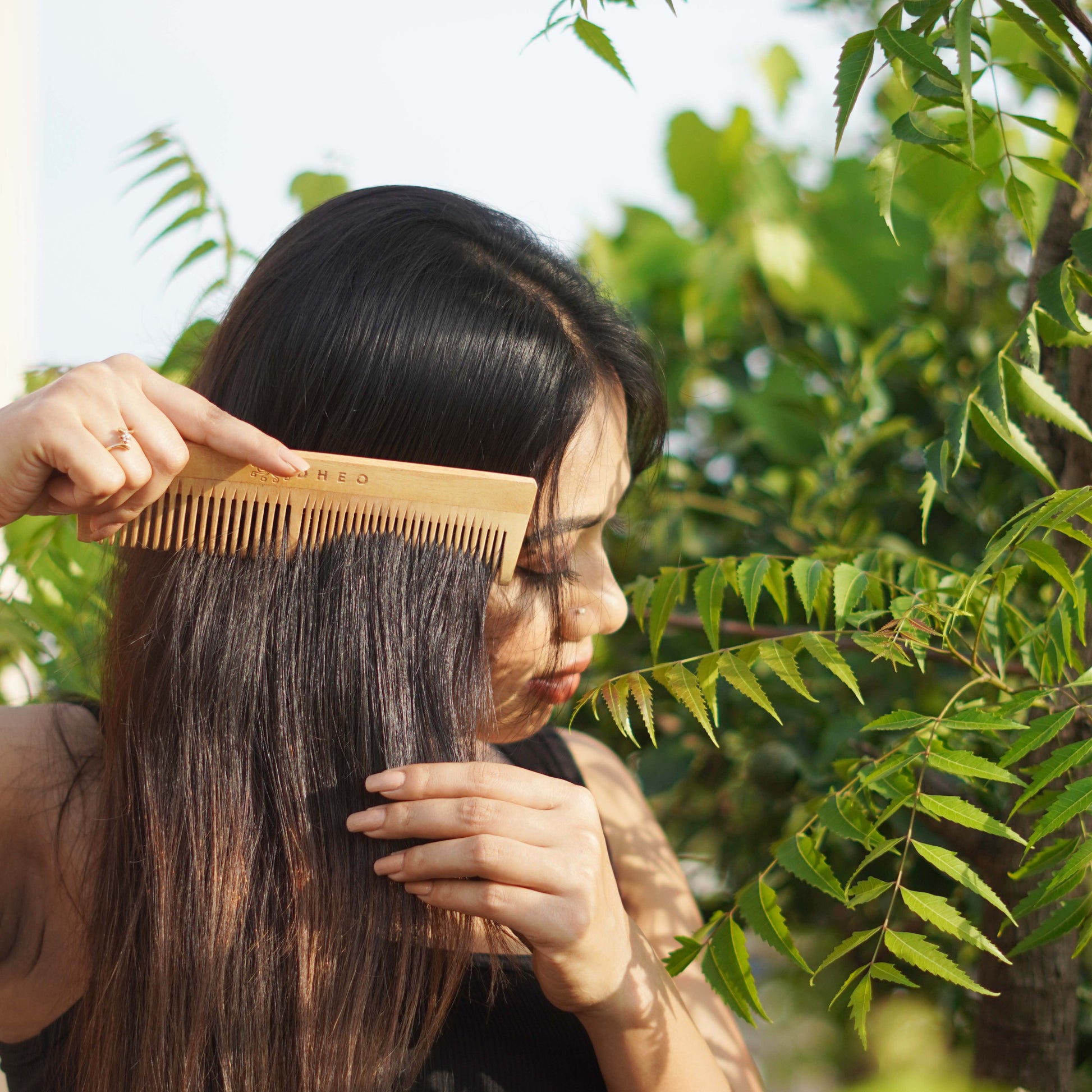 Premium DHEO Neem Comb for scalp massage — gentle wooden comb that boosts circulation, reduces dandruff, and supports hair growth.