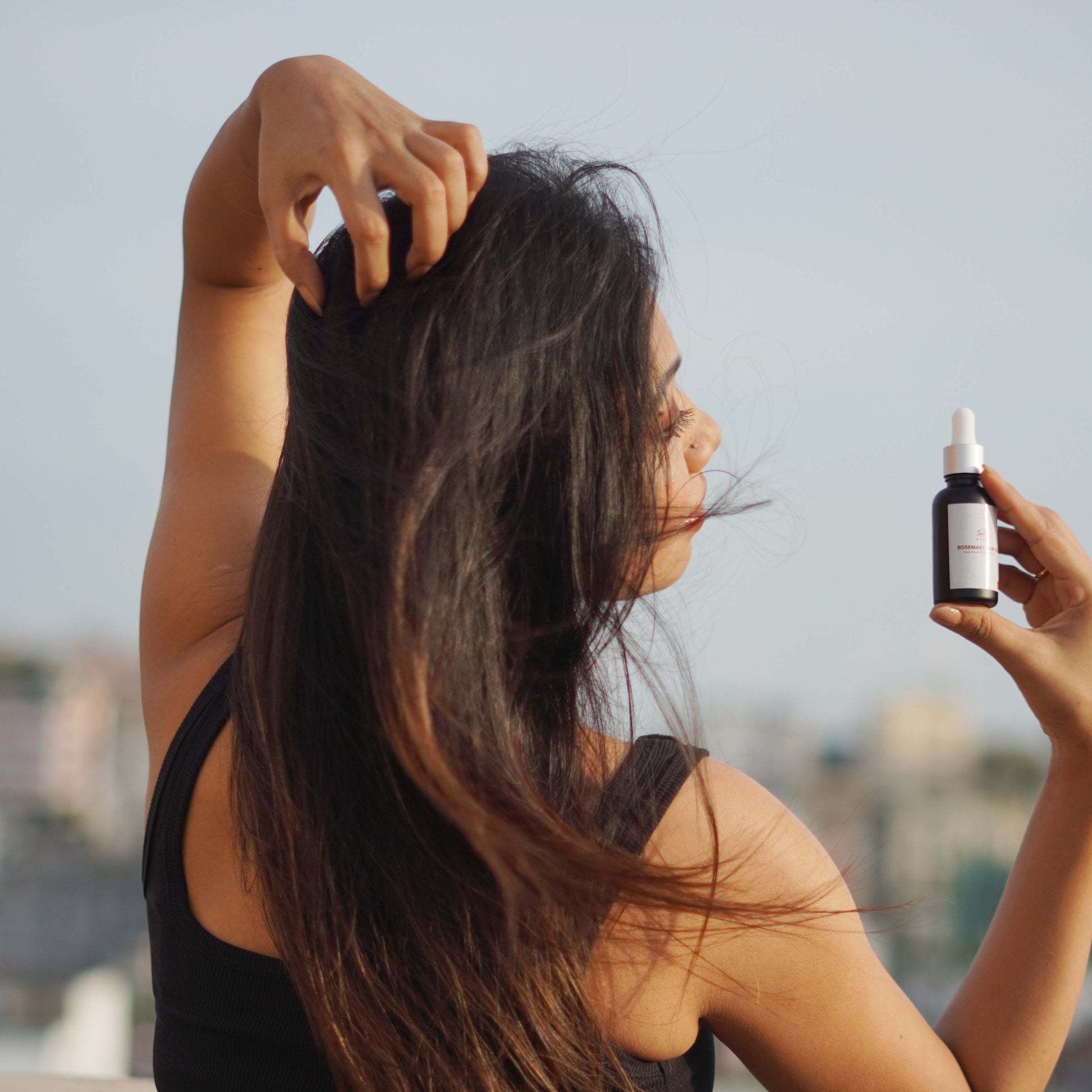 DHEO Rosemary Hair Oil 30ml — natural blend of castor, rosemary, and sunflower oils to reduce hair fall, strengthen roots, and boost healthy scalp circulation.