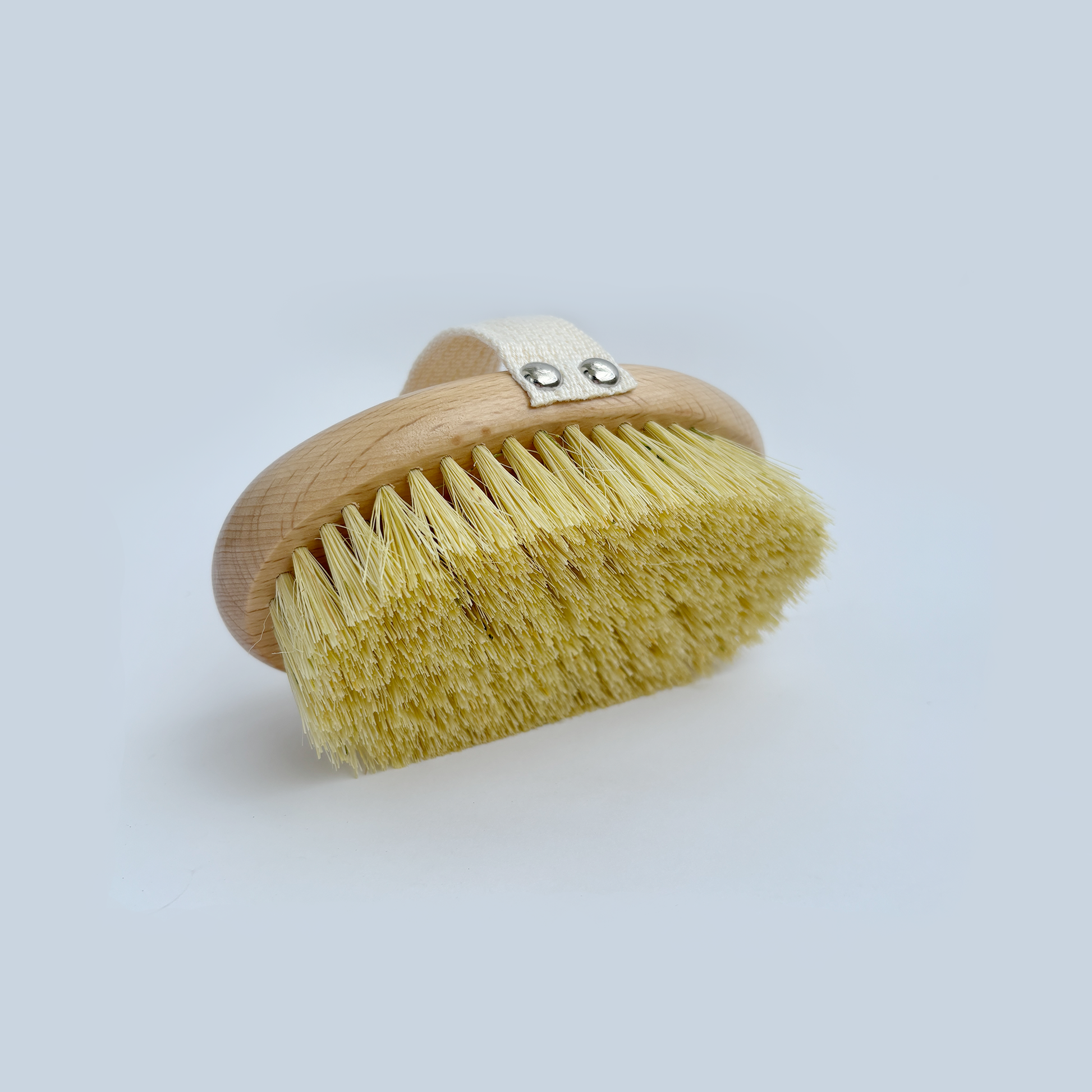 Gently exfoliate and energize your skin with this sisal dry brush. Use before showering in upward strokes toward the heart. 