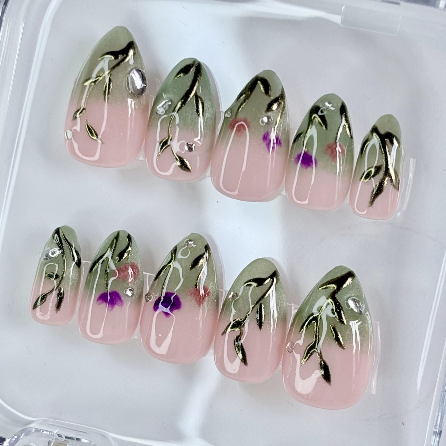Sage Serenity press-on nails flat-lay showing muted sage green with matte finish