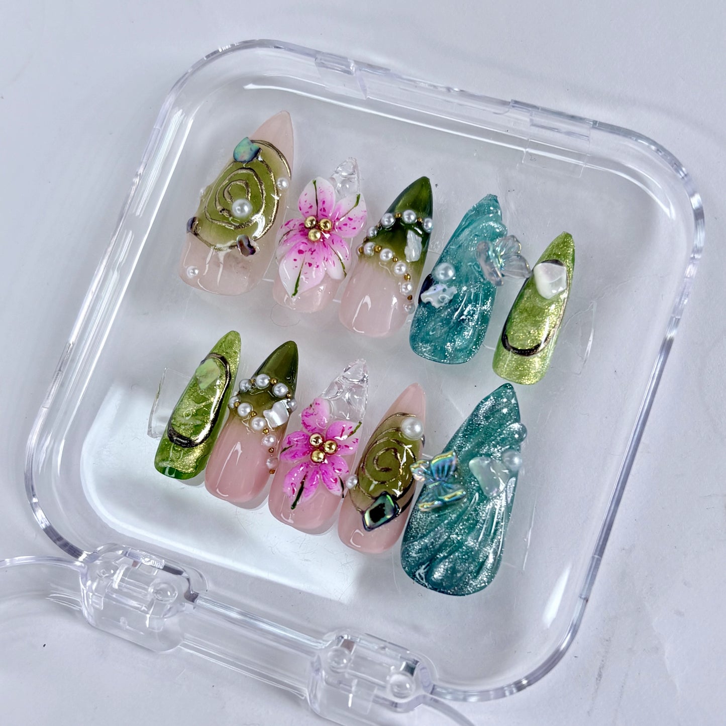 Emerald Reverie press-on nails worn on hand showing rich jewel-green finish