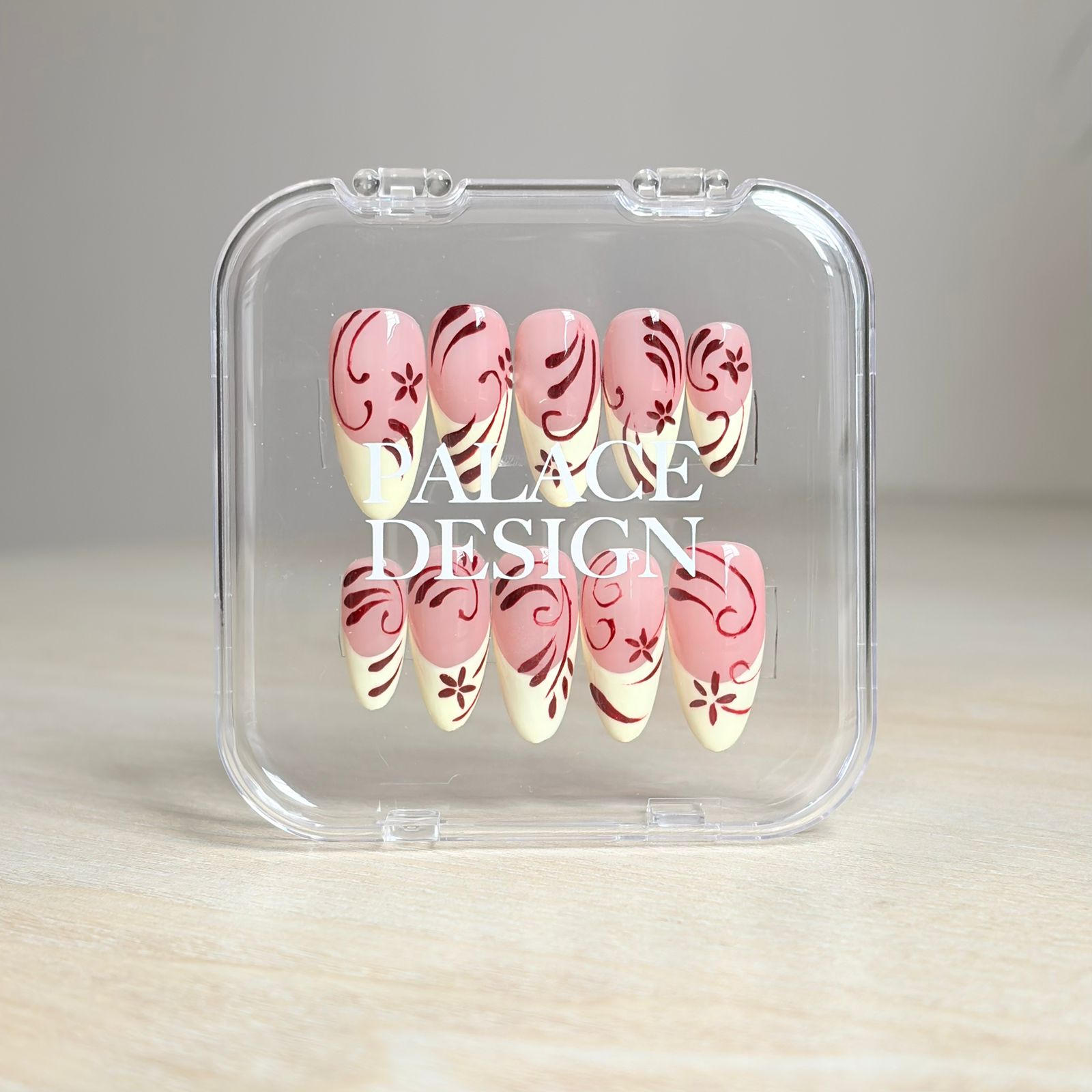 Wildflower press-on nails worn on hand showing vibrant wildflower illustration