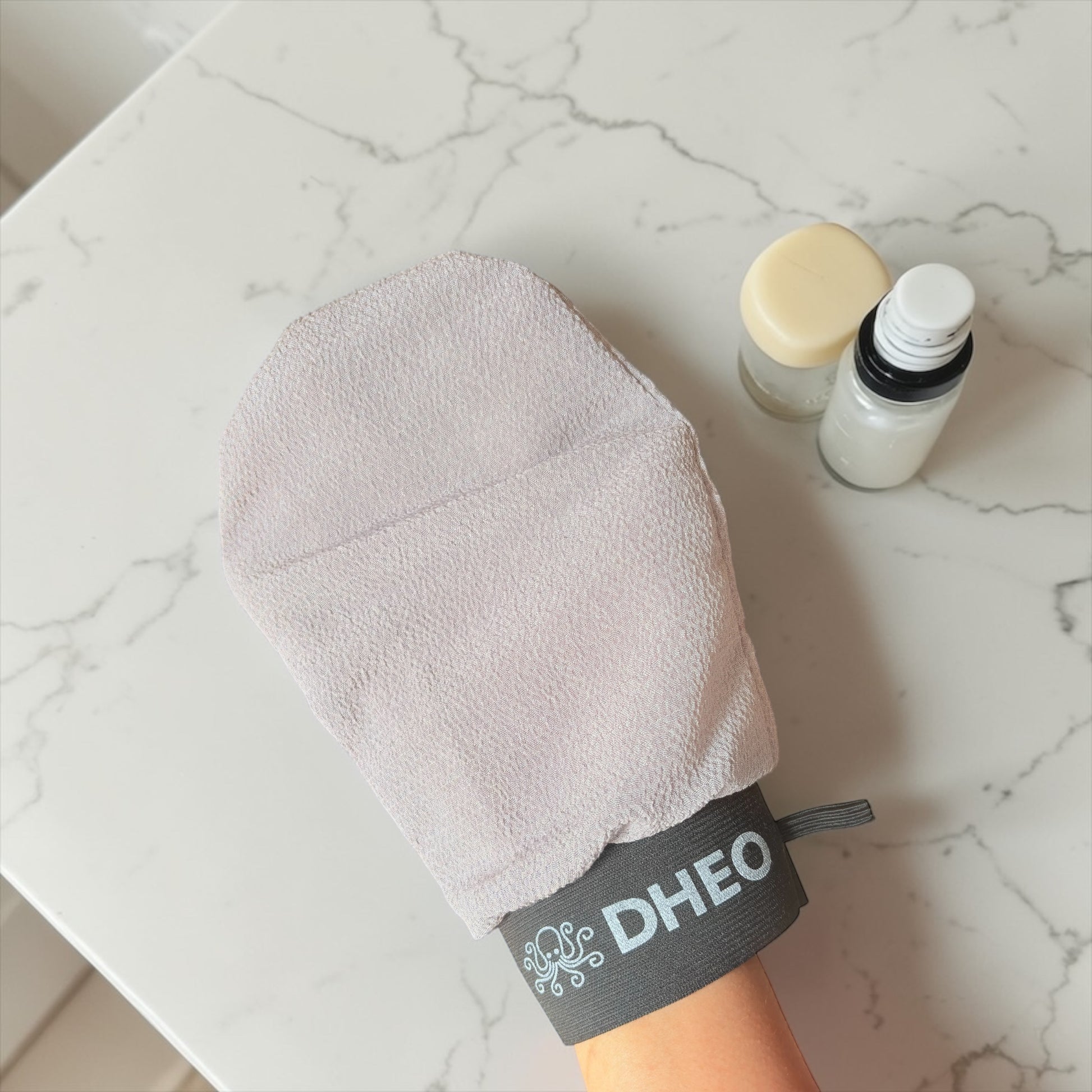 DHEO exfoliating bath mittens — smooth, radiant skin after every shower