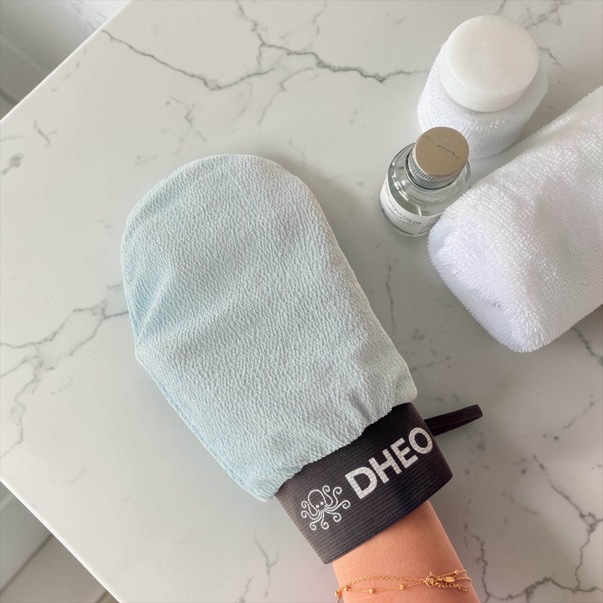 Exfoliating mittens close-up — soft texture, firm grip for deep skin scrubbing
