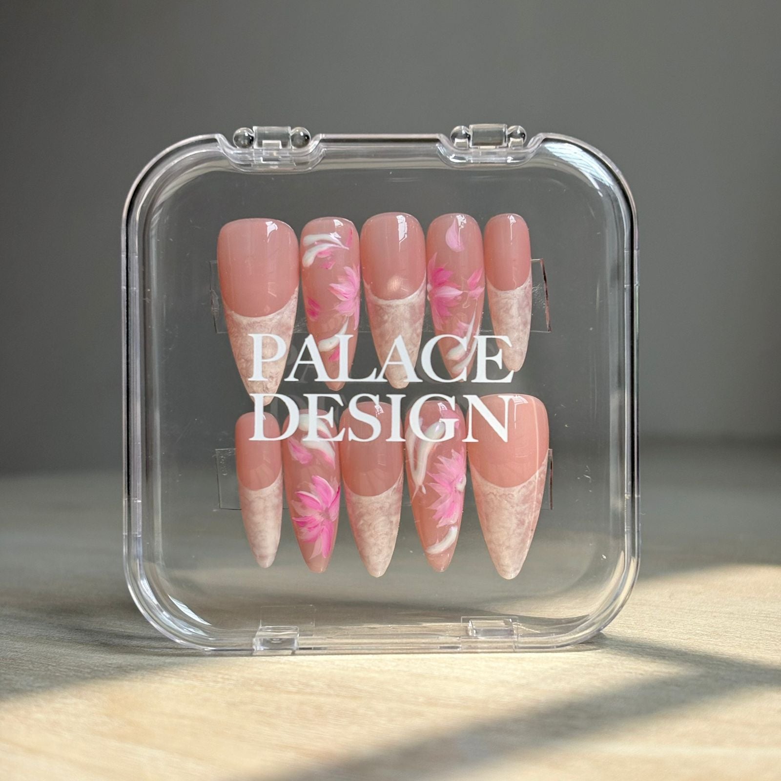 Peony Dreams press-on nails worn on hand showing rosy pink with peony bloom detail