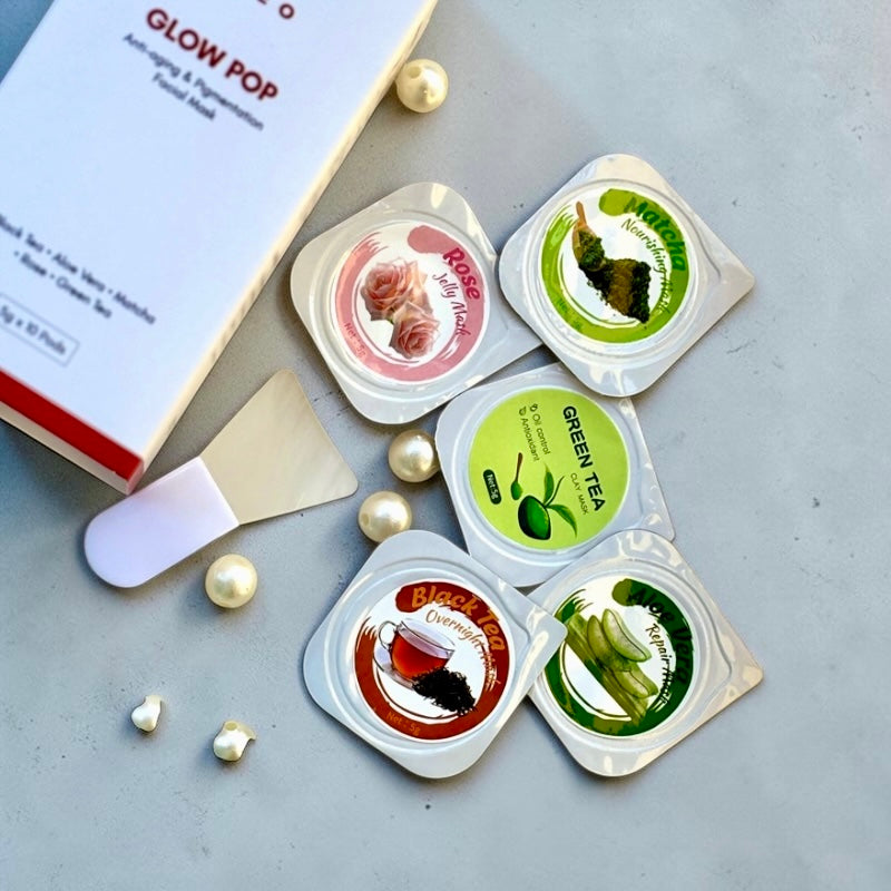 Glow Pop Face Mask pods flat lay showing five variants for glowing skin