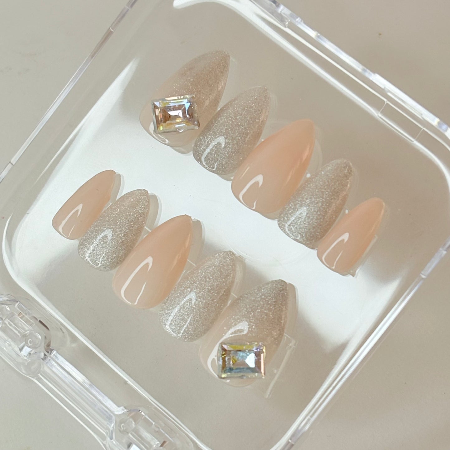 Crystal Luster press-on nails flat-lay showing clear crystal glitter finish