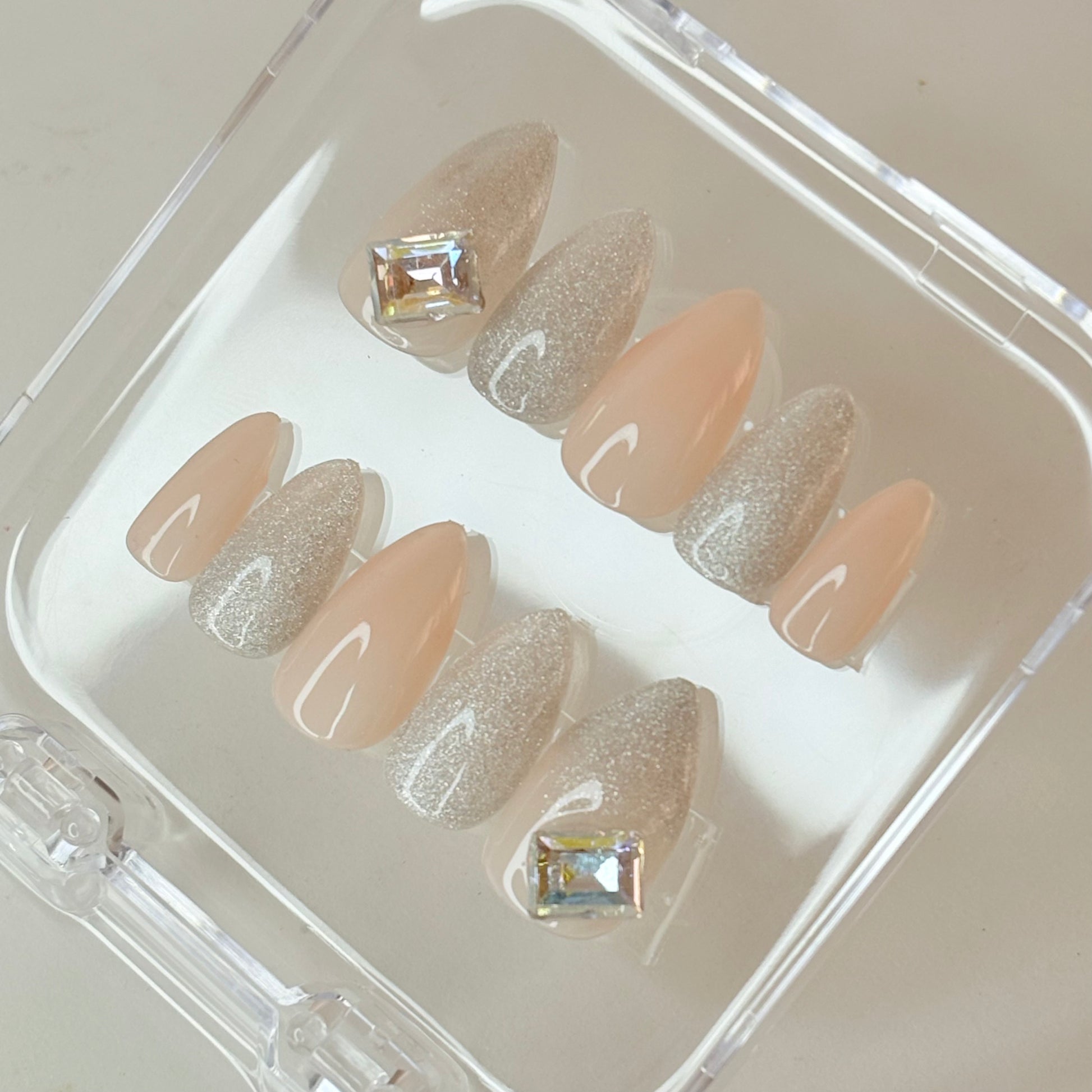 Crystal Luster press-on nails flat-lay showing clear crystal glitter finish