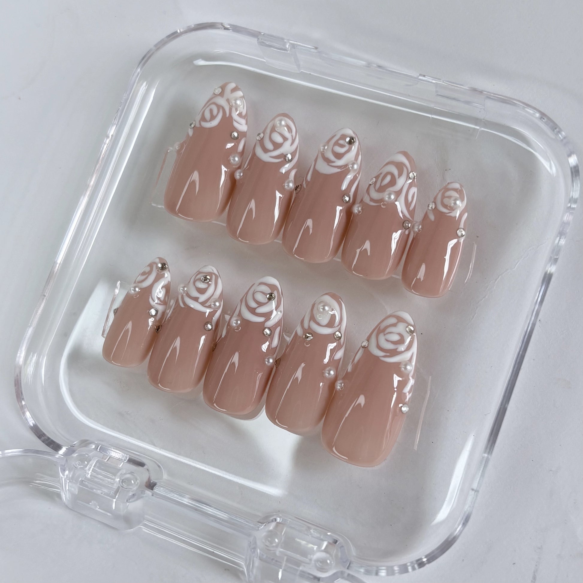 Rose Illusion press-on nails worn on hand showing gradient rose pink tone