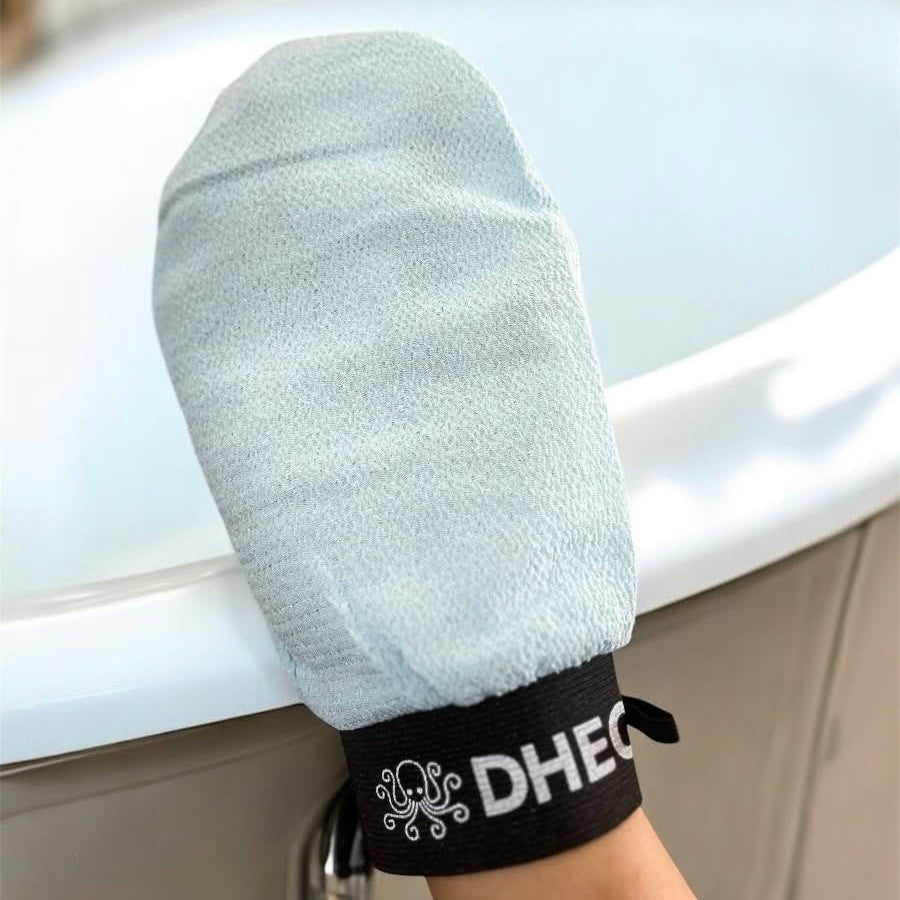 Using exfoliating mittens in shower for full body dead skin removal | DHEO