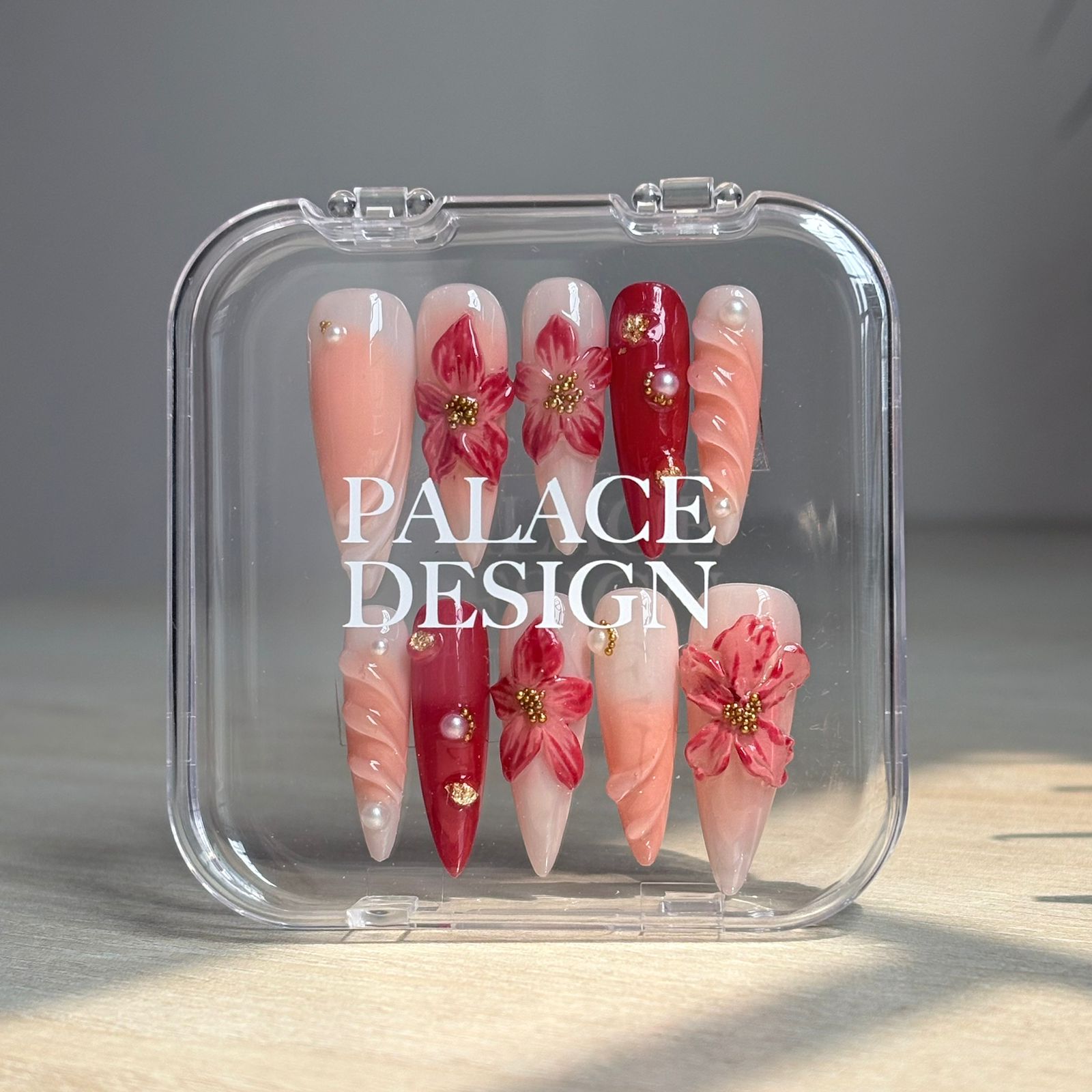 Meadow Bloom press-on nails worn on hand showing soft green with meadow florals