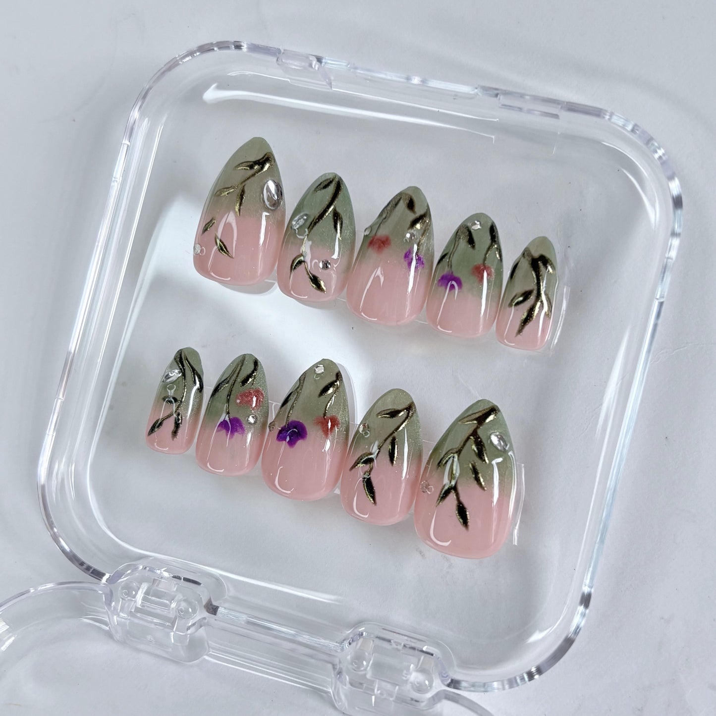 Sage Serenity press-on nails worn on hand showing calm sage green tone